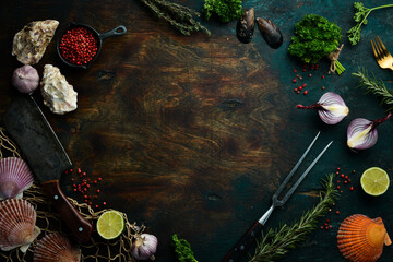Old wooden-stone cooking background. Spices and vegetables. Top view. Free space for your text.