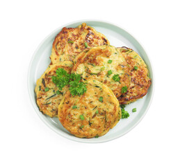 Delicious zucchini fritters with curly parsley on white background, top view