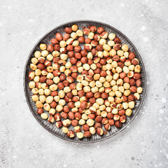 Walnut background. Hazelnuts on a stone background. Top view. Free space for text.