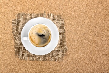 Espresso or black coffee in white cup on wooden desk