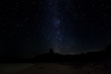 Lake Michigan coast in Door County, Wisconsin, the USA under a starry night sky - obrazy, fototapety, plakaty