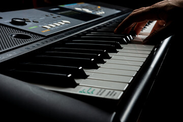 Professional electronic piano. Playing the synthesizer. Black and white keys.