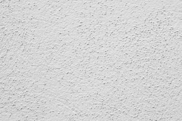Painted wall with rough texture closeup. White plaster with brushed texture, house wall, copy space