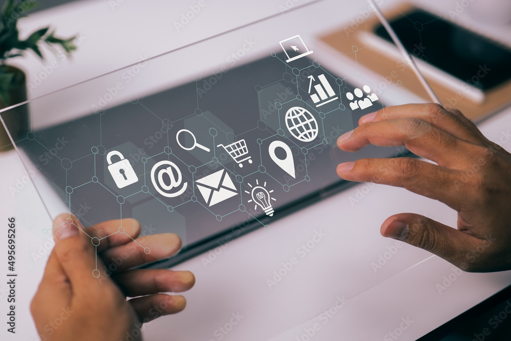 Poster in a modern workplace with virtual icons interface, a businessman works with a digital tablet, a boo