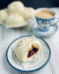 Char Siu Bao, steamed bun with sweet char siu pork filling.