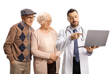 Elderly man and woman and a doctor pointing at a laptop computer