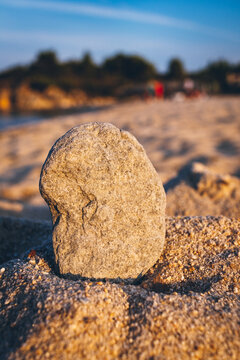 Stone wishes close up in the sand on the beach.