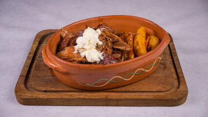 Closeup shot of a breakfast in the brown plate on the white background