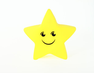 Room night lamp in the form of a yellow star, glows in the interior. Cute funny baby lamp on isolated background. Children's toy yellow star on an isolated white background.