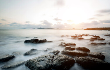 Sunset on the rocky shore.