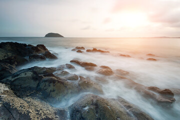 Sunset on the rocky shore.
