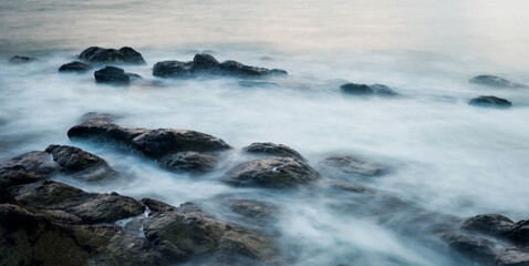 Sunset on the rocky shore.