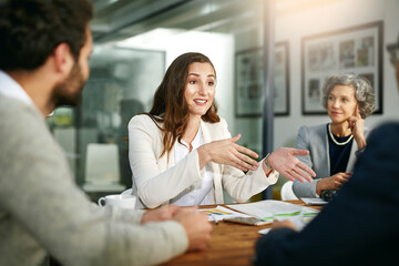 Putting her ideas forward. Cropped shot of a group of businesspeople meeting in the boardroom.