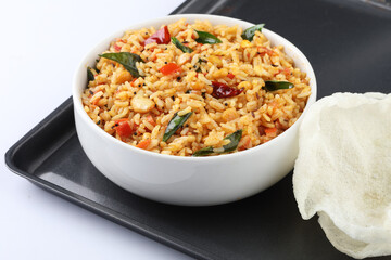 Tomato rice. spicy South Indian rice cooked rice with Tomato and HERBS Tomato pulao, an Indian vegetarian dish. Healthy nutritious tomato rice