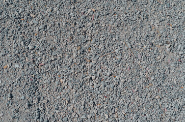 Gray fine gravel. Stone background. Extraction of natural materials.