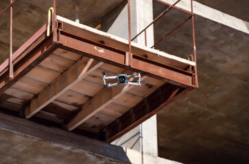 Drone flight near concrete structures. Observations on construction. Modern technology.