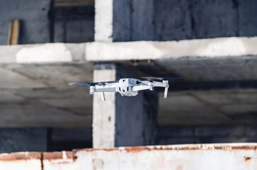 Drone flight near concrete structures. Observations on construction. Modern technology.