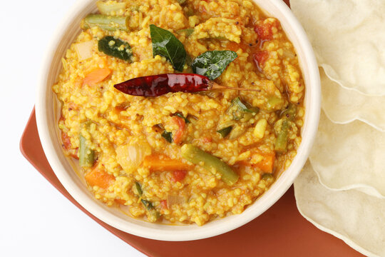 South Indian traditional vegetarian rice dish, bisi bele bath, Sambar rice with rice and pigeon pea as the main ingredients.