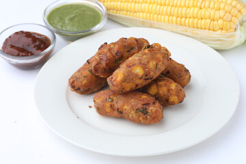 Crispy Corn pakora/pakoda, bhajji, Bhaji, bajji or pattice . served with tomato ketchup