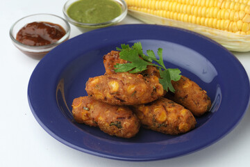 Crispy Corn pakora/pakoda, bhajji, Bhaji, bajji or pattice . served with tomato ketchup