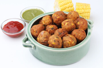 Crispy Corn pakora/pakoda, bhajji, Bhaji, bajji or pattice . served with tomato ketchup