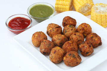 Crispy Corn pakora/pakoda, bhajji, Bhaji, bajji or pattice . served with tomato ketchup
