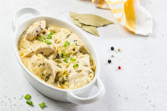 Low calorie dietitian chicken fillet coconut cream sauce in ceramic dish. Space for text.
