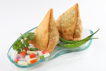 Veg Samosa - is a crispy and spicy Indian triangle shape snack which has crisp outer layer of maida filling of mashed potato, peas and spices