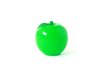 Green artificial plastic apple isolated on white background
Small case, lip balm. Children's toy.