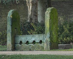 In the middle ages stocks like these in Roberts Park Saltaire were a popular punishment allowing those who had been mistreated by the prisoner to pelt him or her with rotten fruit and vegetables