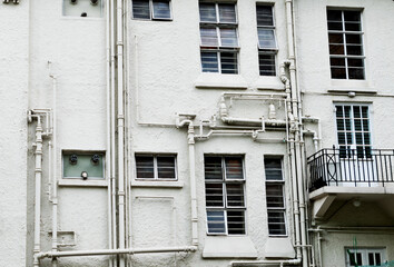 Old apartment building wall with pipe