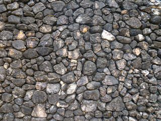 The walls are made of stacked stones.