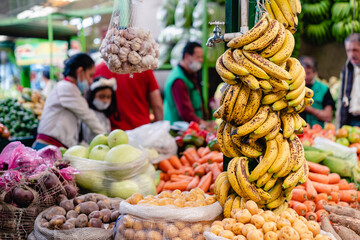 stacked vegetables in paloquemado market square of Bogota_Colombia

