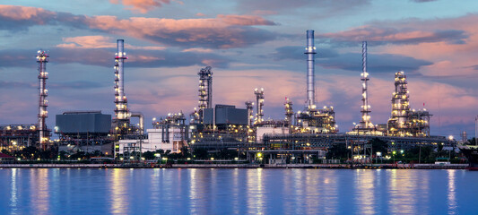 Oil and gas refinery plant area at sunrise	near sea port or river
