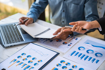 Team brainstorming process. Photo young business crew working with new startup project.Notebook on wood table. Idea presentation, analyze marketing plans.
