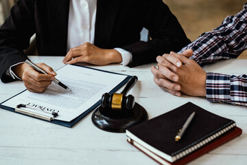 Lawyers give advice about judgment, agreements, Consultation of Businesswoman and Male lawyer or...
