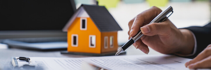 Real estate agent working sign agreement document contract for home loan insurance approving...