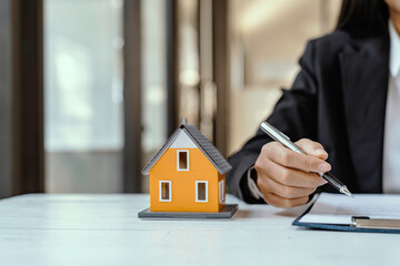 Business Signing and analyzing a contract buy - sell house, insurance agent analyzing cost about...