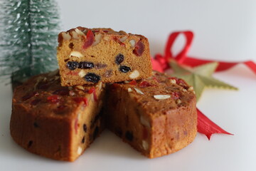 Sliced fruit cake with rum soaked fruits and nuts prepared for christmas.