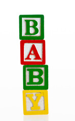 Word baby writing with wooden blocks