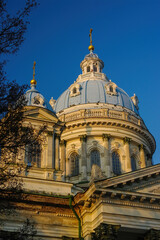 Obraz premium Blue cupolas of Holy Trinity Cathedral in Sumy, Ukraine illuminated with golden sunset light