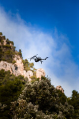 Fototapeta na wymiar gray drone flying over rural landscape