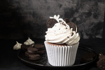 Chocolate cupcake with cream and Oreo cookies