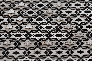 Metalwork design featuring rows of intricate silver Jewish stars of David at the entrance to the Mt. Herzl military cemetery in Jerusalem.