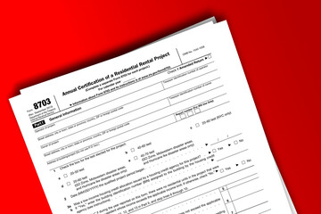 Obraz premium Form 8703 documentation published IRS USA 08.29.2013. American tax document on colored