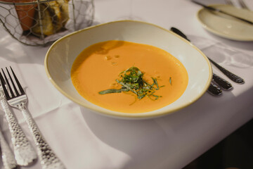 fine dining pumpkin soup in a white bowl