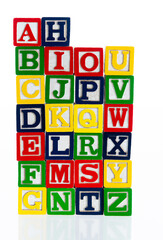 Wooden alphabet blocks on white background