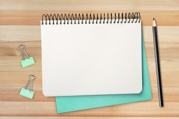 Square notepad with pen. Minimal workspace mockup. School concept with copyspace.