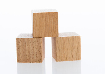 Three wooden blocks on white background