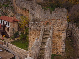 Alanya, turkey, winter walk by mediterranean sea. part of fortress wall of ancient castle of Alanya